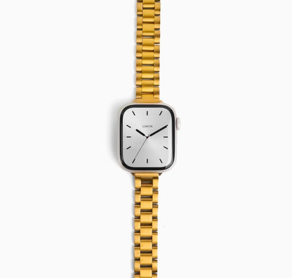 Slim Oyster Apple Watch Band in gold stainless steel, watch face view on white