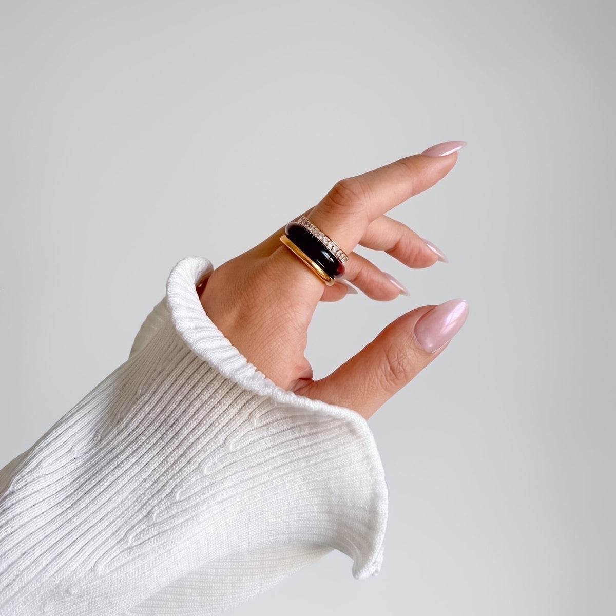 Tiramisu Ring Set on a raised hand, side view of the three stacked rings